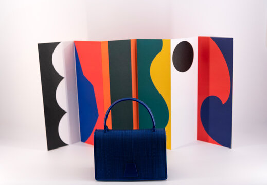 Luxury elegant bag of fashion accessory. Fashion luxury bag. Blue leather bag collection. Female bag on showcase of fashionable store showcase