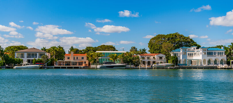 Modern building Miami. Residential apartment in waterfront city. Waterfront landscape with house. Vacation building in summer. Luxury waterfront house. Hotel building. Residential architecture