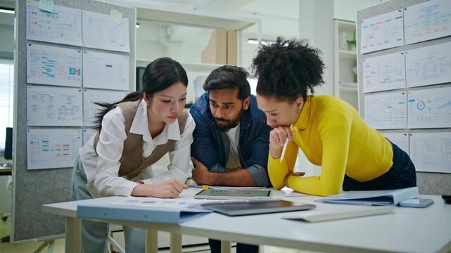 Collaboration and analysis by business people working in office.Planning,innovation,vision,business marketing strategy.Group,team discussing with sticky notes a schedule for future project together