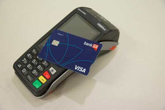 Semaphore, South Australia - July 22 2026: debit card on a payment terminal for financial transactions