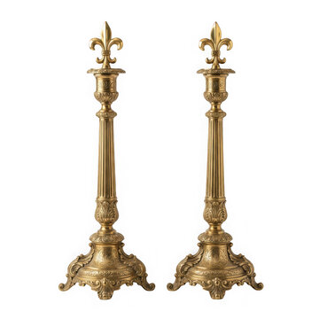 Pair of antique ornate brass candlesticks with fleurdelis finials isolated on transparent background