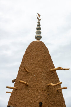 A crescent and star finial tops a wooden-pegged spire of the 17th-century Sudano-Sahelian mosque, Savanes district, Kouto, Ivory Coast