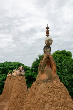 A cluster of mud pinnacles topped with ceramic caps and a crescent finial forms the skyline of the 17th-century Sudano-Sahelian mosque, Savanes district, Kouto, Ivory Coast