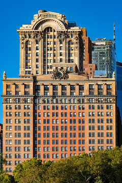 Historic facade of the Whitehall Building located at 17 Battery Place in downtown Manhattan, New York, featuring classical architectural details with modern high-rise buildings in the background.