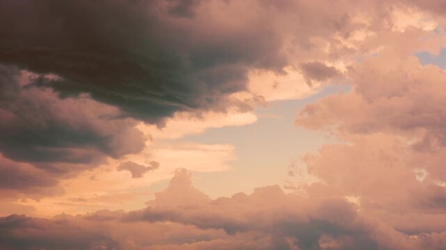 Beautiful pastel clouds moving slowly in seamless background loop