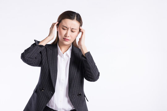 Stressed Businesswoman Suffering From Headache And Migraine
