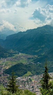 Interlaken Switzerland timelapse of rushing clouds over Jungfrau mountain valley and Harder Kulm viewing platform in summer