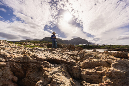 photographer on Kammabaai Beach, Hermanus, South Africa