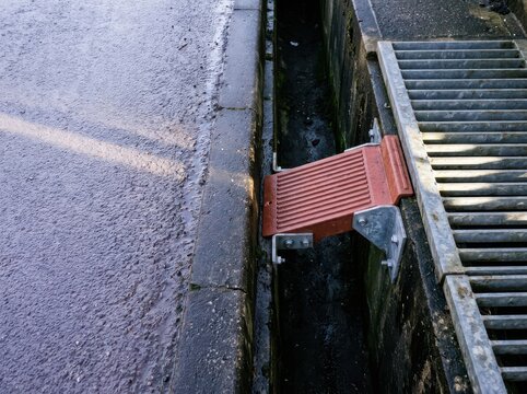 Storm Drain Crossing with Channel Grate and Red Drain Bridge