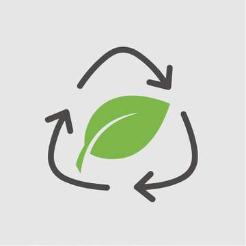 Recycle symbol with green leaf