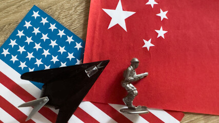 Obraz premium Toy plane with USA and china flag 