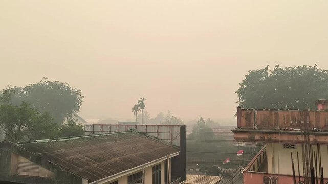 Pontianak Rooftops and Trees Swathed in Thick Ochre Haze
