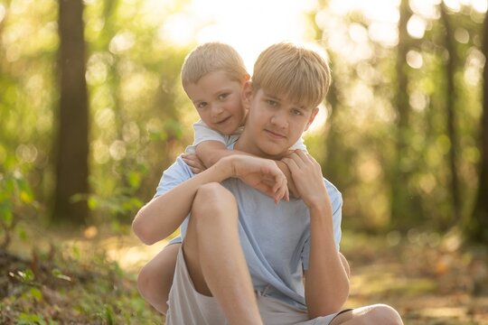  two happy brothers sitting together. 