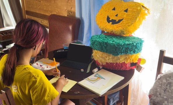 The girl is doing creative work.