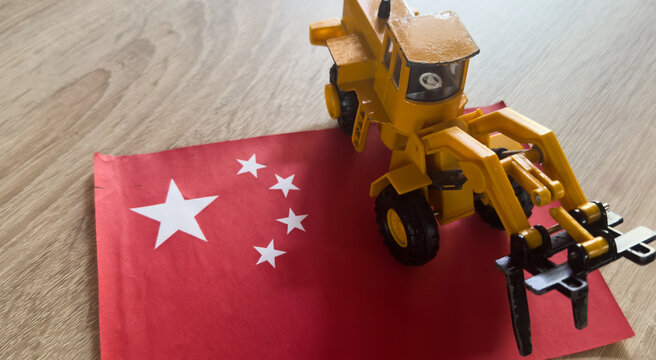 Chinese flag with commercial truck excavator