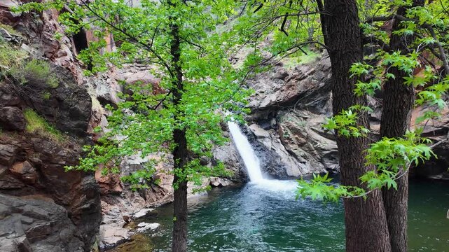 Scenic Toparlar waterfall and crystal clear pool with rope swing in Mugla, Turkey