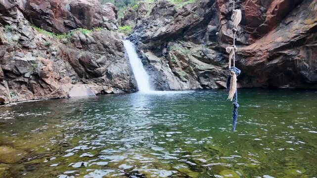 Natural swimming pool fed by Toparlar waterfall and surrounded by rocky cliffs, Mugla, Turkey