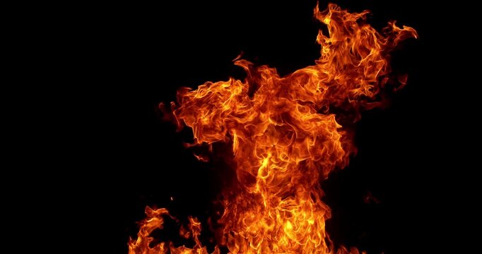 Ultra slow motion fire flames with glowing embers and sparks on black background captured at 1000 FPS. Dramatic combustion effect ideal for cinematic overlays and visual effects.