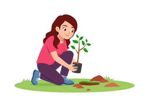 Young Asian woman smiling while kneeling and carefully planting a tree sapling in the soil
