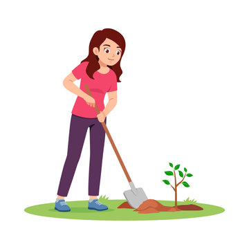 Happy young Asian woman planting a small tree with a shovel on green grass with a bright smile