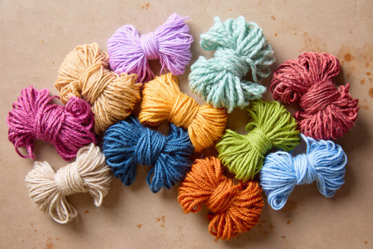 Fluffy colorful yarn in a variety of colors and textures for knitting, crochet and handmade crafts.