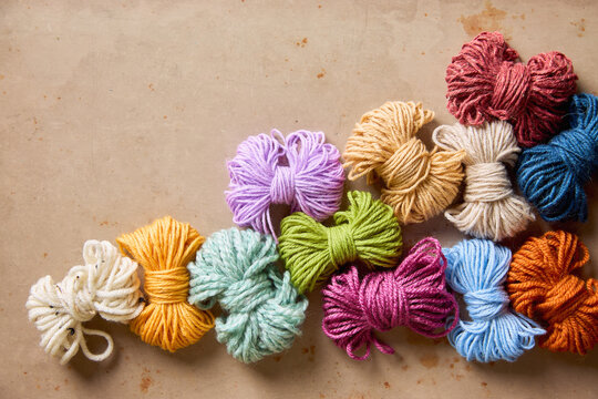 Fluffy colorful yarn in a variety of colors and textures for knitting, crochet and handmade crafts.
