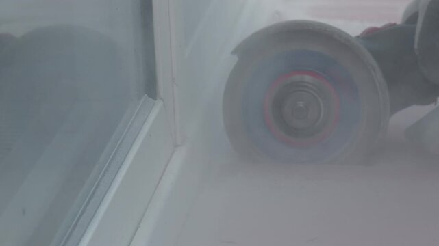 Inline skate wheel speeding through smoke on a smooth indoor surface
