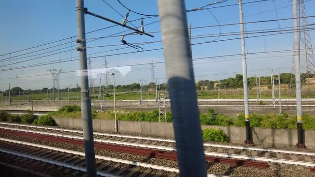 Europe, Italy , Milan 09,17,2026  - Frecciarossa  Hight speed 300km h train railway from Milan  to Rome and Naples   -  looking out the train window, the faster way to travel in Italy for tourist and 