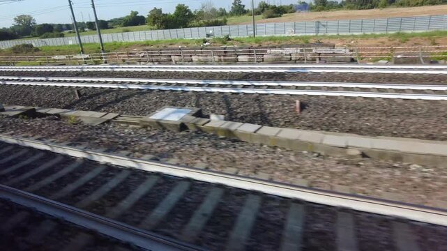Europe, Italy , Milan 09,17,2026  - Frecciarossa  Hight speed 300km h train railway from Milan  to Rome and Naples   -  looking out the train window, the faster way to travel in Italy for tourist and 
