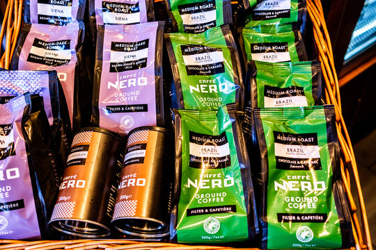 In-House Display Of Caffe Nero Branded Bags Of Ground Coffee And Tins Of Hot Drinking Chocolate