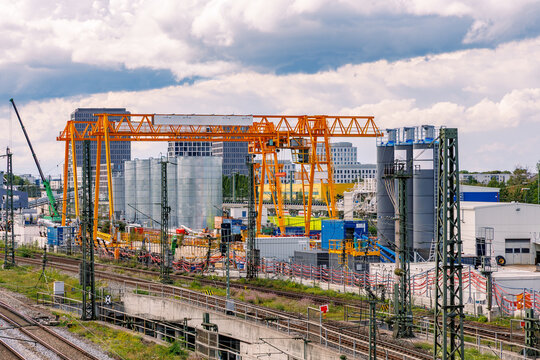 Large-Scale Railway and Urban Infrastructure Construction Site with Tower Cranes and Industrial Equipment