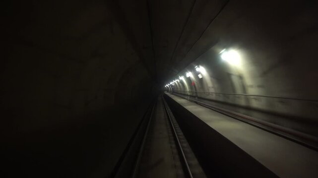 Europe, Italy , Rome , subway train enters underground tunnel at rapid fast speed  - the new line in Rome  self-driving wagon without a driver 
