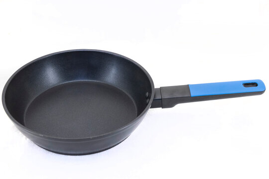 Black frying pan with a blue ergonomic handle, shown in side perspective against a white background for cookware product photography.
