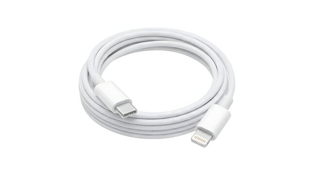 White usb type c charging cable with lightning connector coiled on clean white background