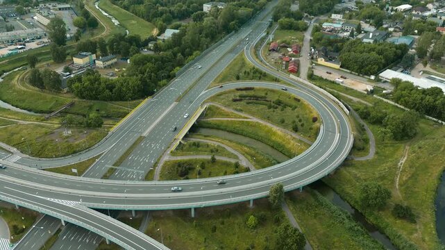 Scenic aerial of road interchange and green fields