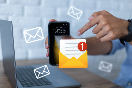 man holding a smartphone with an unread email notification icon on screen, pointing with his finger. Email marketing, digital communication, and online message concept. Scam and Spam, creative