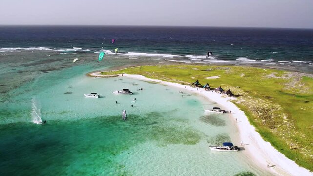 Aerial view of Los Roques archipelago with kite surfers, Venezuela.