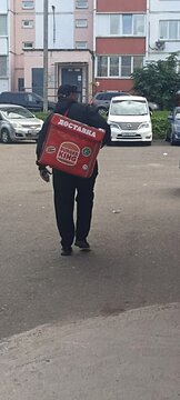  Smolensk, Russia &ndash; September 16, 2026: A Burger King courier is delivering food