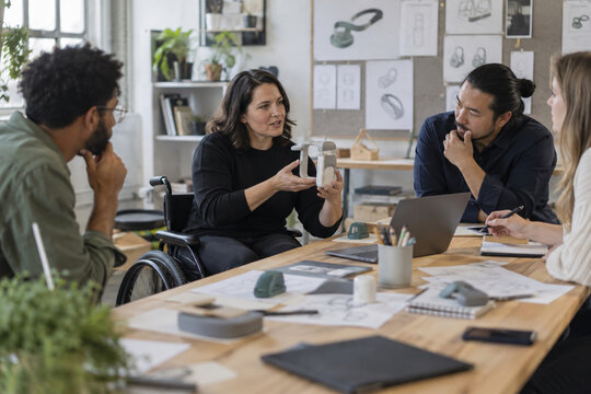 Wheelchair-using product designer leading a prototype review