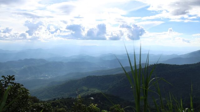 Panoramic Mountain Landscape Under Dramatic Blue Sky and Clouds