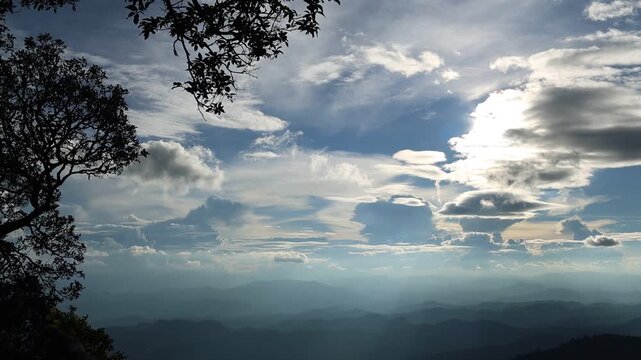 Panoramic Mountain Landscape Under Dramatic Blue Sky and Clouds