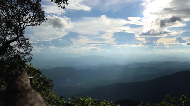 Panoramic Mountain Landscape Under Dramatic Blue Sky and Clouds