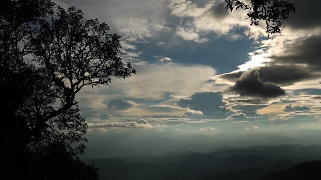 Panoramic Mountain Landscape Under Dramatic Blue Sky and Clouds