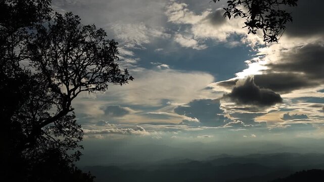 Panoramic Mountain Landscape Under Dramatic Blue Sky and Clouds