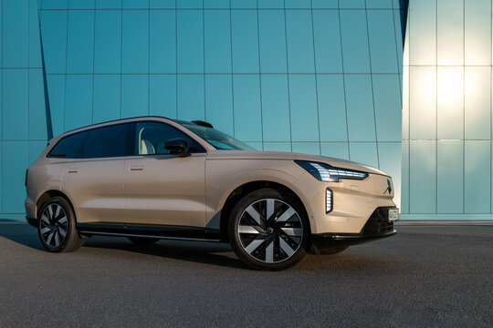 Kyiv, Ukraine - August 20, 2026: New Volvo EX 90 electric car near blue wall