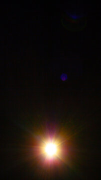 Sun flare on the black background
