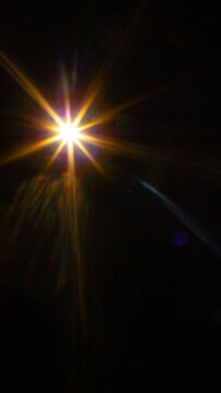 Sun flare on the black background