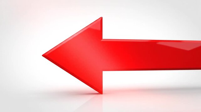 Bright red three dimensional arrow pointing left on a clean white background.