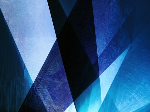 Abstract geometric strips in blue and black cross a textured grainy plane with crisp edges for digital branding and corporate presentations