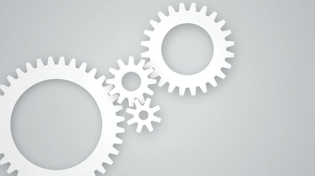Interlocking white vector gear cogs rotating seamless loop motion